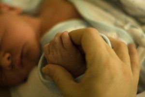 Holding Hands With a Newborn Baby