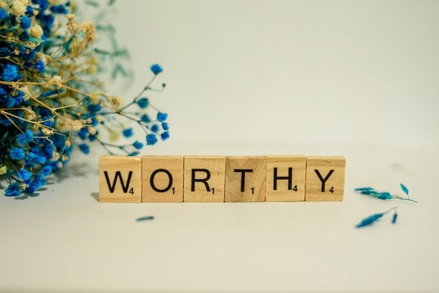 Word worthy spelled out in Scrabble letters